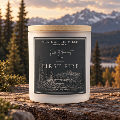 Trail & Trust First Fire candle, Fall 2026 — hero image with mountain landscape
